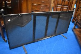 A metal fire safety guard, having double central doors. W 136, H 57cm.