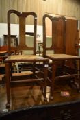 A pair of stained frame bedroom chairs having bergere cane seats