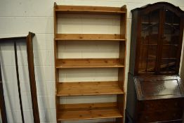 A modern pine waterfall bookshelf, approx. H199, W93cm
