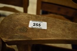 A set of six rush seated chapel chairs having ladder backs, with hymn/prayer book shelves