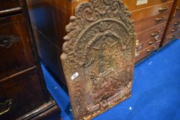 A cast iron fireback having pictorial decoration