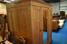A natural pine mirror door wardrobe, approx H196 W170 D65cm
