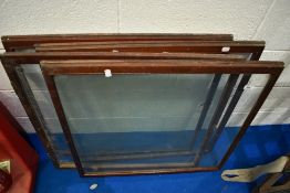 A set of four vintage glazed shop cabinet doors