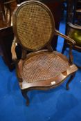 A French style carver chair having bergere cane seat and back panel