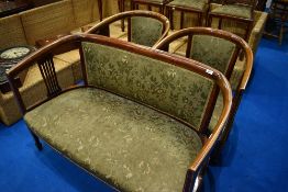 An Edwardian mahogany seven piece salon suite