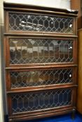 A Globe Werncike four tier bookcase, with leaded glass doors