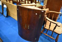 A 19th Century oak bow fronted corner cupboard, height approx. 94cm