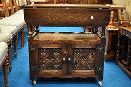 A vintage oak tea trolley in the Titchmarsh and Goodwin Elizabethan style