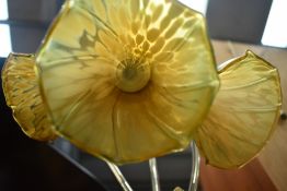 A table lamp, having Art Nouveau styling, with three glass shades of trumpet form.