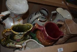 Seven assorted jugs including an Arthur Wood Majolica style jug, an HJ Wood Ltd 'Indian Tree' jug
