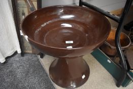 A vintage brown glazed stoneware jardiniere stand and pedestal.
