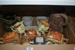 A group of novelty cottage ware teapots, an Arthur Wood green glaze jug, and three stoneware jars