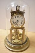 A late 19th/early 20th Century brass anniversary clock, by Gustav Becker, having an enamelled