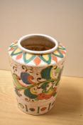 A Japanese crackle glazed ceramic vase, with stylised polychrome design, measuring 23cm tall