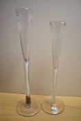 A pair of 19th Century etched glass table centres with air twist stems, the largest measures 72cm