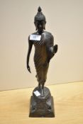A 19th/20th Century spelter Standing Buddha ornament, measuring 44cm tall