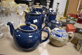 A selection of Denby stone ware jugs, coffe pots and a tea pot and two other teapots and a storage