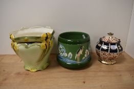 Two early 20th century Jardinieres, one having stork decoration and the other lillies sold with a