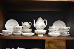 A Japanese egg shell tea service, decorated with traditional subject matter