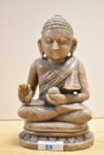 A 20th Century carved hard stone seated Thai Buddha, measuring 21cm tall