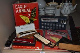 An collection of vintage items, including Eagle Annuals, Parker pens, transistor radio and a
