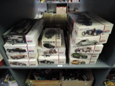Twelve Monogram 1:24 scale Vintage Car plastic Model Kits, all opened, some part made, not checked