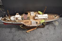 A scratch built wooden model Boat based on the Paddle Steamer, complete with belt driven brass