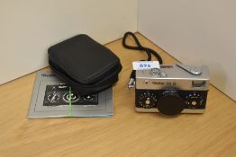 A Rollei 35S camera with booklet