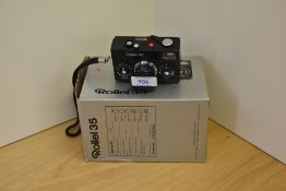 A boxed Rollei 35 camera (small dent to the body)