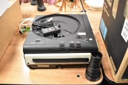 A Leitz Pradolux RT300 carousel slide projector with Leitz Colorplan 2,5 90mm lens and Leitz Elemart