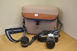 A Nikon FE camera with 2x Nikkor 1:1,4 50 mm lenses