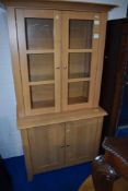 A modern beech effect lounge unit, approx. width 99 x height 195cm, base height 84cm