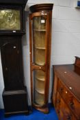 A reproduction slim double height corner display, height approx 201cm, depth 33cm