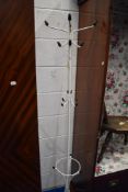 A vintage metal atomic style hat stand