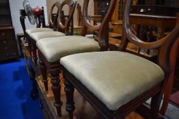 A set of four Victorian mahogany balloon back dining chairs