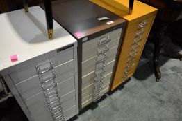 Three sets of metal filing drawers