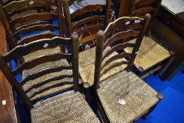 A set of six 19th century rush seated ladder back chairs
