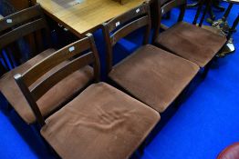 A set of four vintage teak designer low back dining chairs, possibly G plan or similar