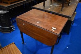 A 19th Century Pembroke table, in the Regency style having line inlay and square tapered legs,