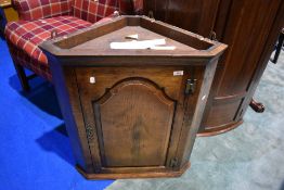 A nice quality reproduction golden oak corner wall cupboard