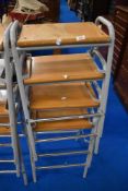 A set of four vintage school or similar lab or workshop stools