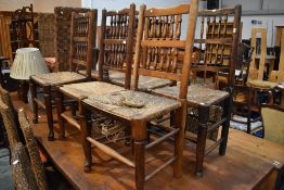 A set of six (five plus one) spindle back kitchen chairs, having rush seats, some damage to one