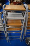 A set of four vintage school or similar lab or workshop stools