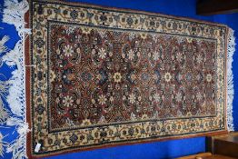 A persian style rug, approx. 127 x 72cm