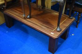 A composite coffee table, approx dimensions 111x54x37cm