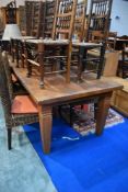 A modern teak refectory table, seats 12, approx 3.10 x 1.04m