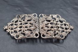 A Queen Elizabeth II silver nurses belt buckle, of pointed rectangular form, moulded and pierced