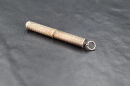 An early Queen Elizabeth II silver propelling toothpick, of traditional engine-turned form with