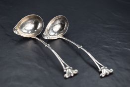 A pair of George V imported Danish Georg Jensen silver sauce ladles, with Georg Jensen mark,