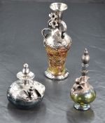 An interesting white metal mounted glass bottle, of spreading form with slender flared neck